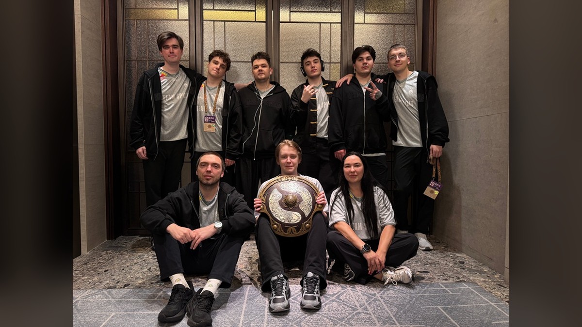 The Team Spirit roster posing with its third Aegis